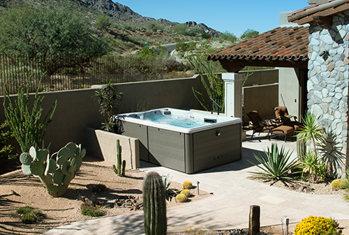 Desert view of a swim spa in a backyard installation